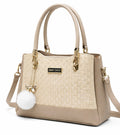 Elegant Beige Designer Handbag with Gold Hardware & Pom-Pom Charm