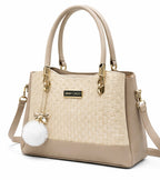 Elegant Beige Designer Handbag with Gold Hardware & Pom-Pom Charm