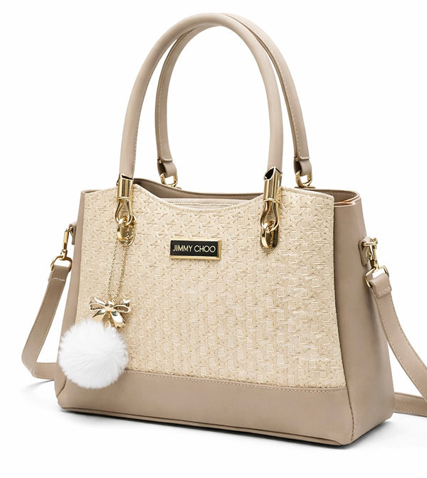 Elegant Beige Designer Handbag with Gold Hardware & Pom-Pom Charm