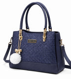 Elegant Navy Blue Designer Handbag with Gold Hardware & Pom-Pom Charm