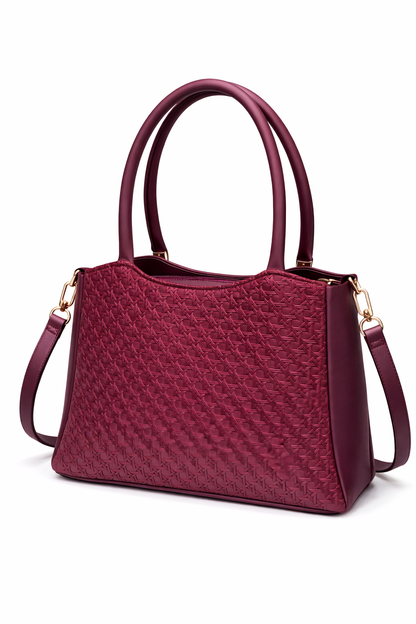Elegant Designer Handbag with Gold Hardware & Pom-Pom Charm