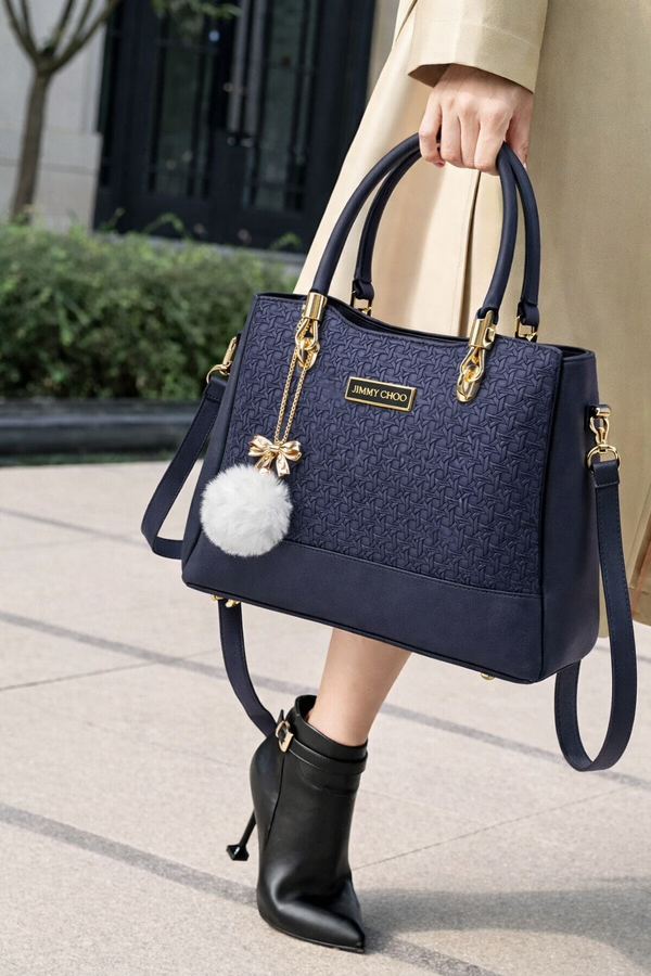 Elegant Navy Blue Designer Handbag with Gold Hardware & Pom-Pom Charm
