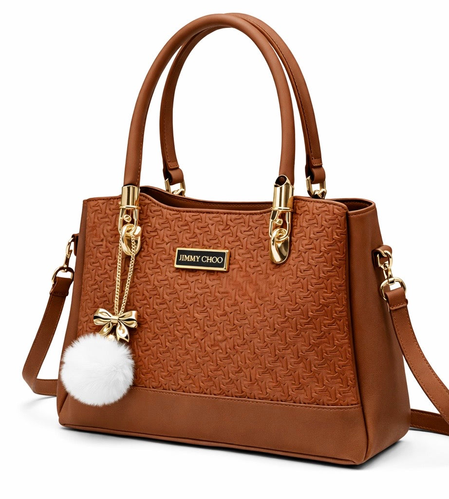 Elegant Camel Brown Designer Handbag with Gold Hardware & Pom-Pom Charm