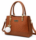 Elegant Camel Brown Designer Handbag with Gold Hardware & Pom-Pom Charm